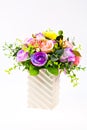 Colorful artificial beautiful flowers in a vase