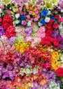 Colorful artificial flowers top view multicolor bouquet full frame,