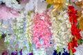 Colorful artificial paper flowers hanging on a stage. Royalty Free Stock Photo