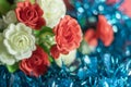 Colorful artificial rose flowers on blue background. Selective focus Royalty Free Stock Photo