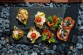 Colorful Assorted Canap s On Slate Bed Outdoors With Fresh Tomatoes, Cheese, and Herbs Royalty Free Stock Photo
