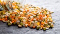 Colorful assorted lentils and whole grains seeds poured from a glass jar on the table