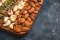 Colorful assorted nuts background - almonds, cashews, pistachios, white almonds texture Royalty Free Stock Photo