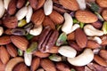 Colorful assorted nuts background - almonds, cashews, pistachios, white almonds texture Royalty Free Stock Photo