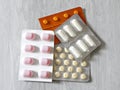 Colorful assorted pills and tablets. Medical concept, gray background