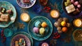 Colorful assorted sweets and decor on festive table with candles Royalty Free Stock Photo