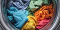 The colorful assortment of fabrics spinning in a modern washing machine. AI generated image Royalty Free Stock Photo