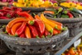 Colorful Assortment of Fresh Chili Peppers in Traditional Market Baskets, Vibrant Red, Yellow, and Green Peppers Display Royalty Free Stock Photo