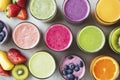 Colorful assortment of fresh fruity smoothies with ingredients overhead Royalty Free Stock Photo