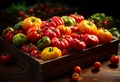 A colorful assortment of peppers in a wooden box. A wooden box filled with lots of red and yellow peppers Royalty Free Stock Photo