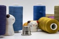 several different spools of thread sit in a pile on top of each other Royalty Free Stock Photo