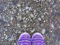 Colorful shoes on the background of the earth