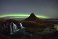 Aurora Borealis over Kirkjufellsfoss and Kirkjufell mountain Royalty Free Stock Photo