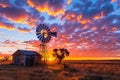 Colorful Australian outback sunset with a windmill. Royalty Free Stock Photo