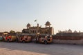 Colorful auto rickshaws or tuk-tuks outside the Lahore Fort at sunset, Lahore