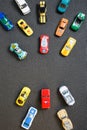 Colorful automotive toys. The apartment was lying, on a gray background