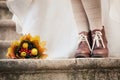 Colorful autumn bouquet and two women legs with le Royalty Free Stock Photo