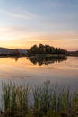 Colorful autumn evening reflecting in lake. Colourful autumn sunset in mountain lake Royalty Free Stock Photo