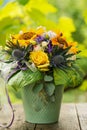 Colorful autumn flower bouquet in a green pot Royalty Free Stock Photo