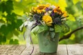 Colorful autumn flower bouquet in a green pot Royalty Free Stock Photo