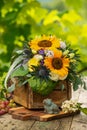 Colorful autumn flower bouquet in a wooden box Royalty Free Stock Photo