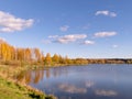 Autumn landscape by the lake, golden autumn, colorful trees and reflections Royalty Free Stock Photo