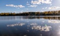 Autumn landscape by the lake, golden autumn, colorful trees and reflections Royalty Free Stock Photo