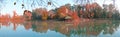 Colorful autumn landscape on the lake shore; panorama Royalty Free Stock Photo