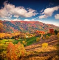 Colorful autumn landscape in mountain village. Royalty Free Stock Photo