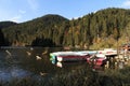 Colorful autumn leaves, and boats in the Killer Lake Royalty Free Stock Photo