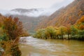 Colorful autumn mountain landscape on Olt river in Romania