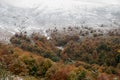 Colorful autumn in the mountains. First snow in october