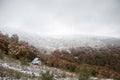 Colorful autumn in the mountains. First snow in october