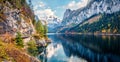 Colorful autumn panorama of Vorderer Gosausee lake with Dachstein glacier on background. Splendid morning view of Austrian