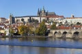 Colorful autumn Prague gothic Castle and Charles Bridge with the Lesser Town in the sunny Day, Czech Republic Royalty Free Stock Photo