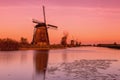 Colorful autumn scene in the famous Kinderdijk canals with windmills. Sunset in Dutch village Kinderdijk, Netherlands, Europe. Royalty Free Stock Photo