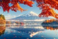 Colorful Autumn Season and Mountain Fuji with morning fog and red leaves at lake Kawaguchiko Royalty Free Stock Photo