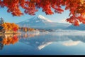 Colorful Autumn Season and Mountain Fuji with morning fog and red leaves at lake Kawaguchiko Royalty Free Stock Photo