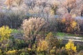 Colorful autumn trees, road and rail Royalty Free Stock Photo