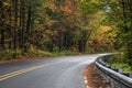 Colorful autumn trees by scenic forest road in Michigan upper Peninsula Royalty Free Stock Photo