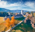 Colorful autumn view from flying drone of Kapelle Cappella di castel Lamberto castel.