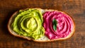 Colorful Avocado And Beetroot Hummus Spread On Artisan Bread With Fresh Mint Leaves Royalty Free Stock Photo