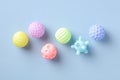 Colorful baby bathing toys on blue table. Flat lay, top view