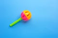 Colorful baby rattle on blue background Royalty Free Stock Photo