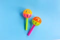 Colorful baby rattle on blue background. Copy space Royalty Free Stock Photo