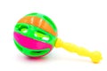 Colorful baby rattle toy with yellow handle isolated on the white background Royalty Free Stock Photo