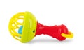 A colorful baby rattle on a white horizontal background Royalty Free Stock Photo