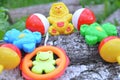 A colorful baby rattle on a wooden background Royalty Free Stock Photo