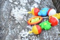 A colorful baby rattle on a wooden background Royalty Free Stock Photo