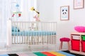 Colorful baby room interior with crib